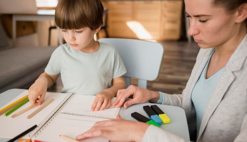side-view-female-tutor-teaching-child-home